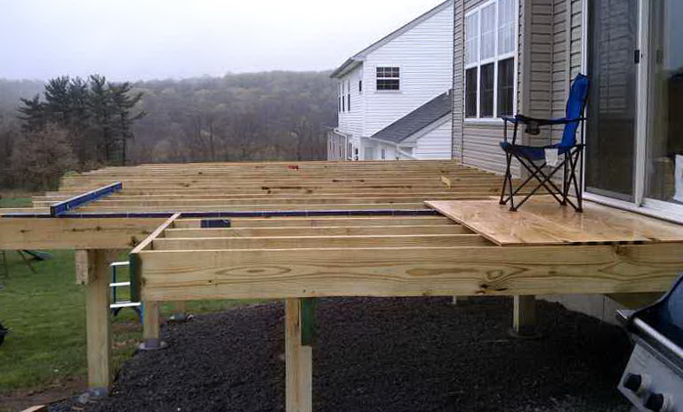 building a deck is how one couple initiated their new home